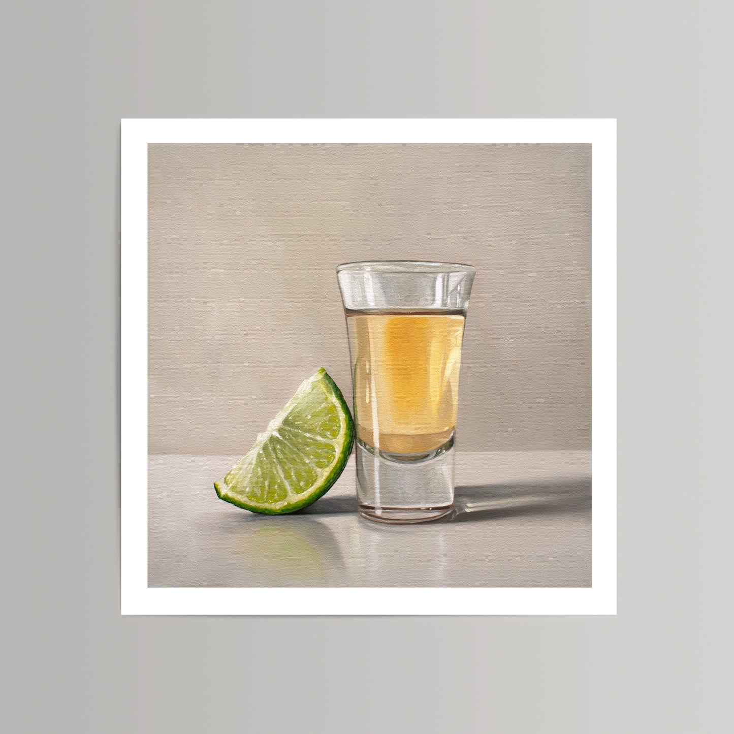 Vibrant fine art print of a tequila shot glass with a bright green lime wedge, on a neutral background.