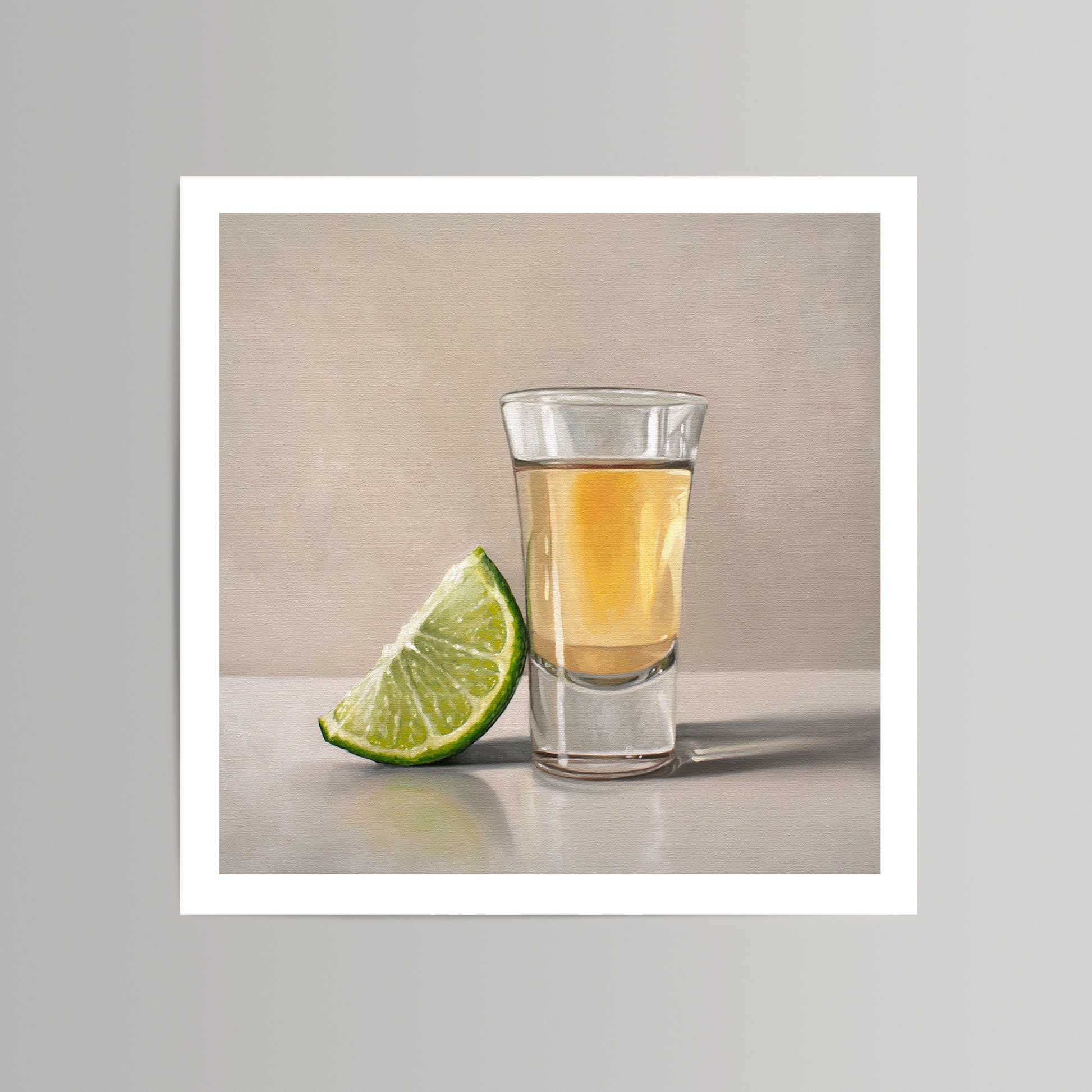 Vibrant fine art print of a tequila shot glass with a bright green lime wedge, on a neutral background.