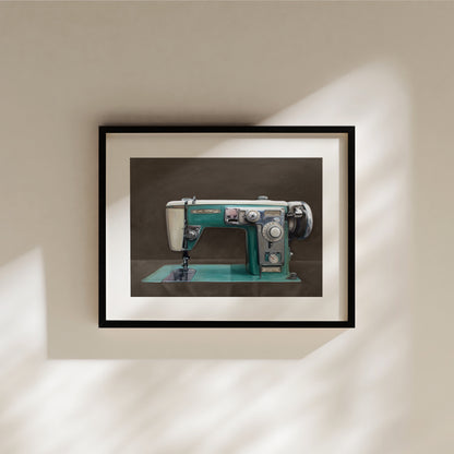 The Wizard Sewing Machine Fine Art Print by Lauren Pretorius: a Wizard vintage turquoise sewing machine with a dark grey background with brown undertones.