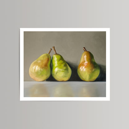 Fine art print featuring three green and red pears on a white surface against a gray background.