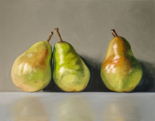 Fine art print of three realistic green and yellow pears with brown stems on a gray background.