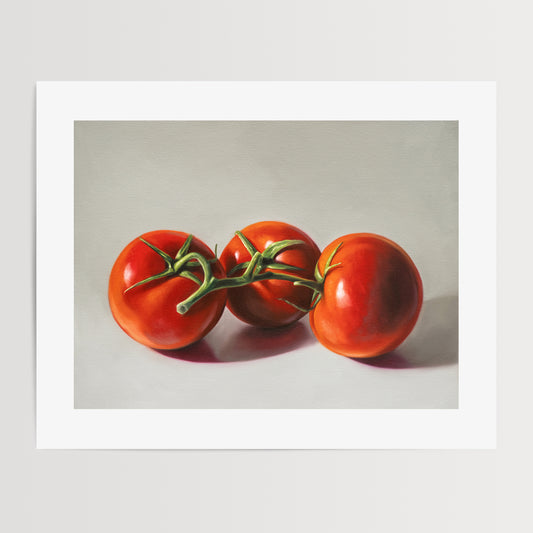 Tomato Trio Fine Art Print by Lauren Pretorius: a trio of tomatoes still on the vine, resting on a light surface with some nice dramatic lighting.