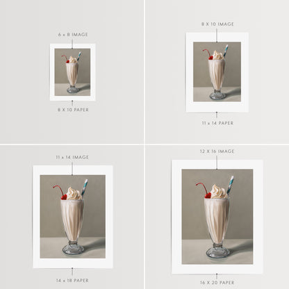 Vanilla Milkshake Fine Art Print by Lauren Pretorius: an ice-cool vanilla milkshake with a generous amount of twisted whip cream, a maraschino cherry and classic striped straw.