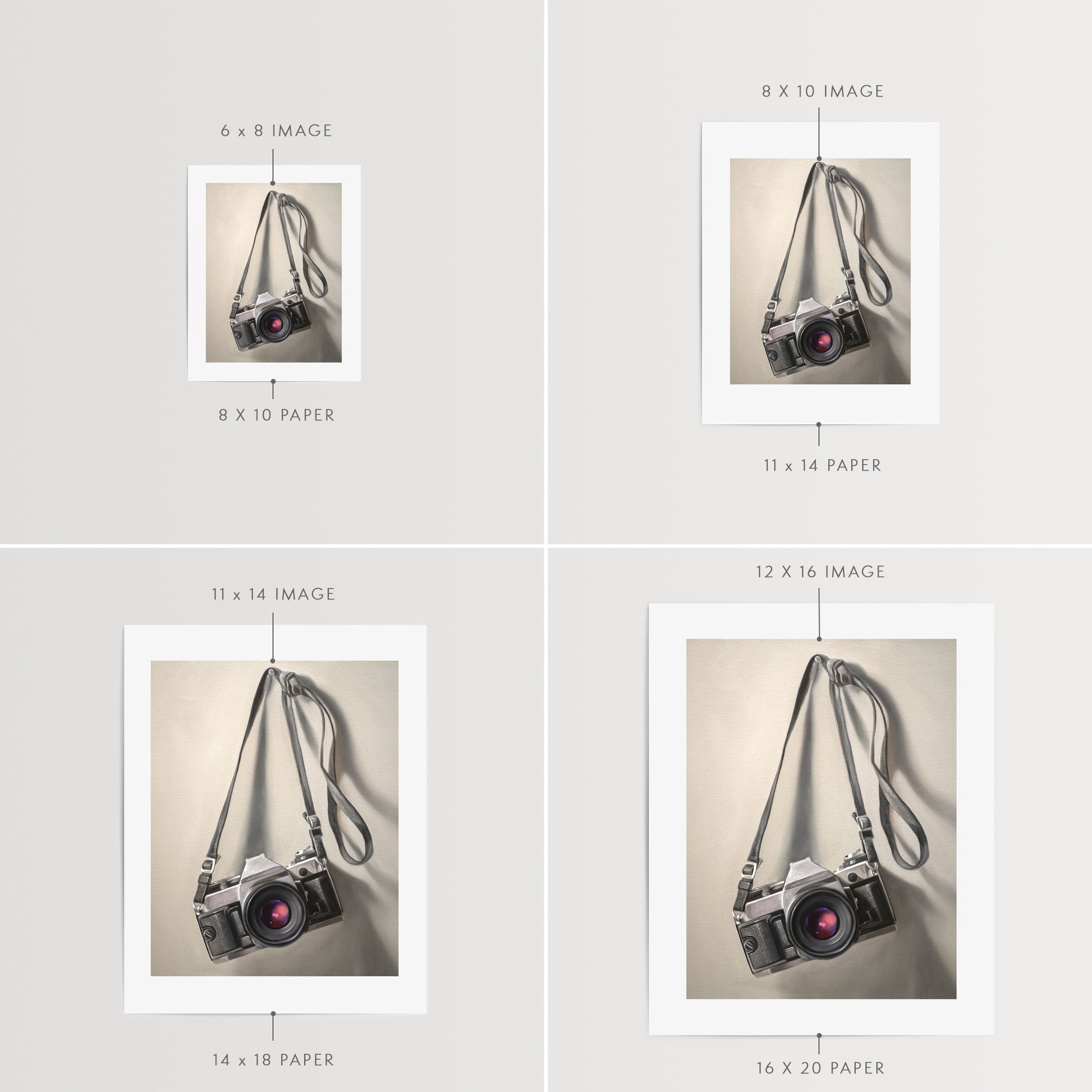 Vintage Film Camera Fine Art Print by Lauren Pretorius: a vintage 35mm camera hanging from its strap with some nice dramatic lighting.