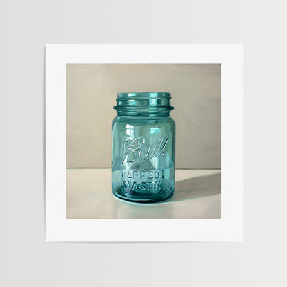 Vintage Turquoise Jar Fine Art Print by Lauren Pretorius: a classic vintage blue glass jar on a light reflective surface.