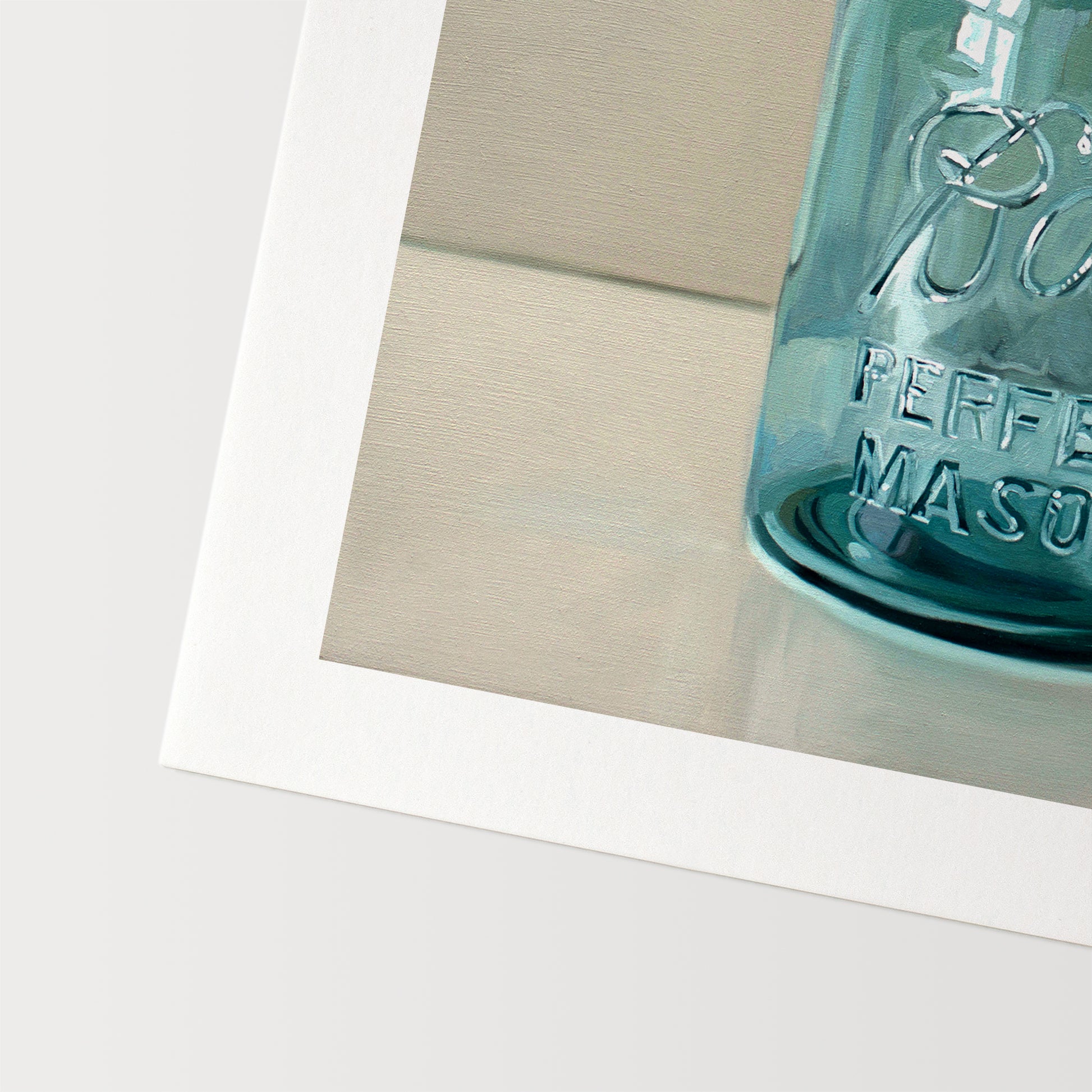 Vintage Turquoise Jar Fine Art Print by Lauren Pretorius: a classic vintage blue glass jar on a light reflective surface.