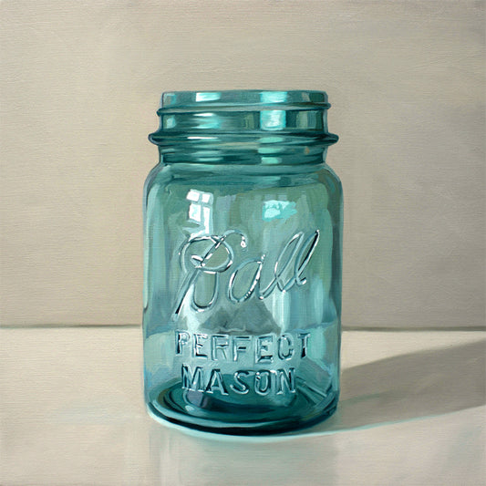 Vintage Turquoise Jar Fine Art Print by Lauren Pretorius: a classic vintage blue glass jar on a light reflective surface.