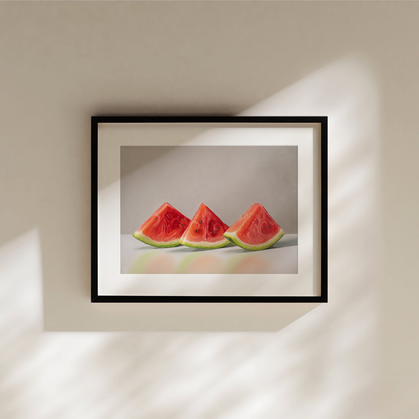 Framed fine art print of three vibrant red watermelon slices with green rinds on a light background.