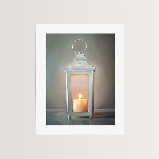 White Candle Lantern Fine Art Print by Lauren Pretorius: a white lantern with a lit candle glowing on the inside.