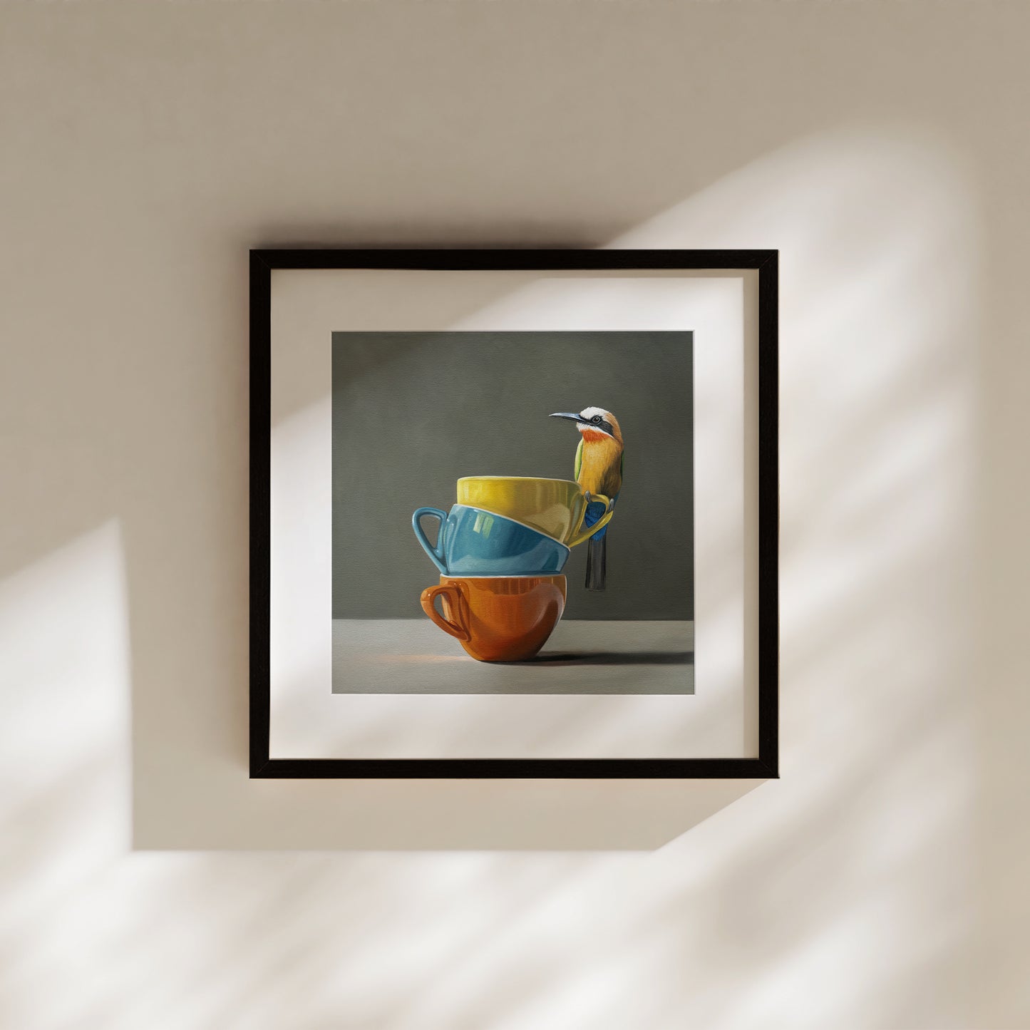 White Fronted Bee Eater & Rainbow Cups Fine Art Print by Lauren Pretorius: a White Fronted Bee Eater perched on top of a stack of colorful coffee cups.