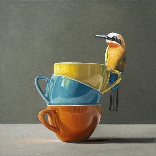 White Fronted Bee Eater & Rainbow Cups Fine Art Print by Lauren Pretorius: a White Fronted Bee Eater perched on top of a stack of colorful coffee cups.