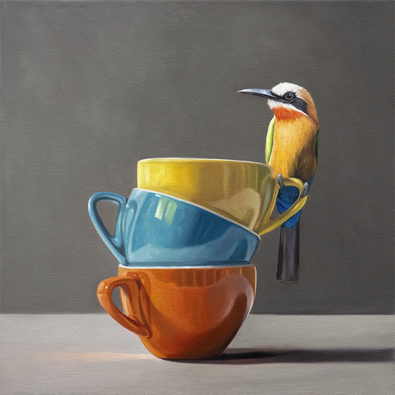 Fine art print of a colorful White-Fronted Bee-Eater perched on a stack of yellow, blue, and orange cups.