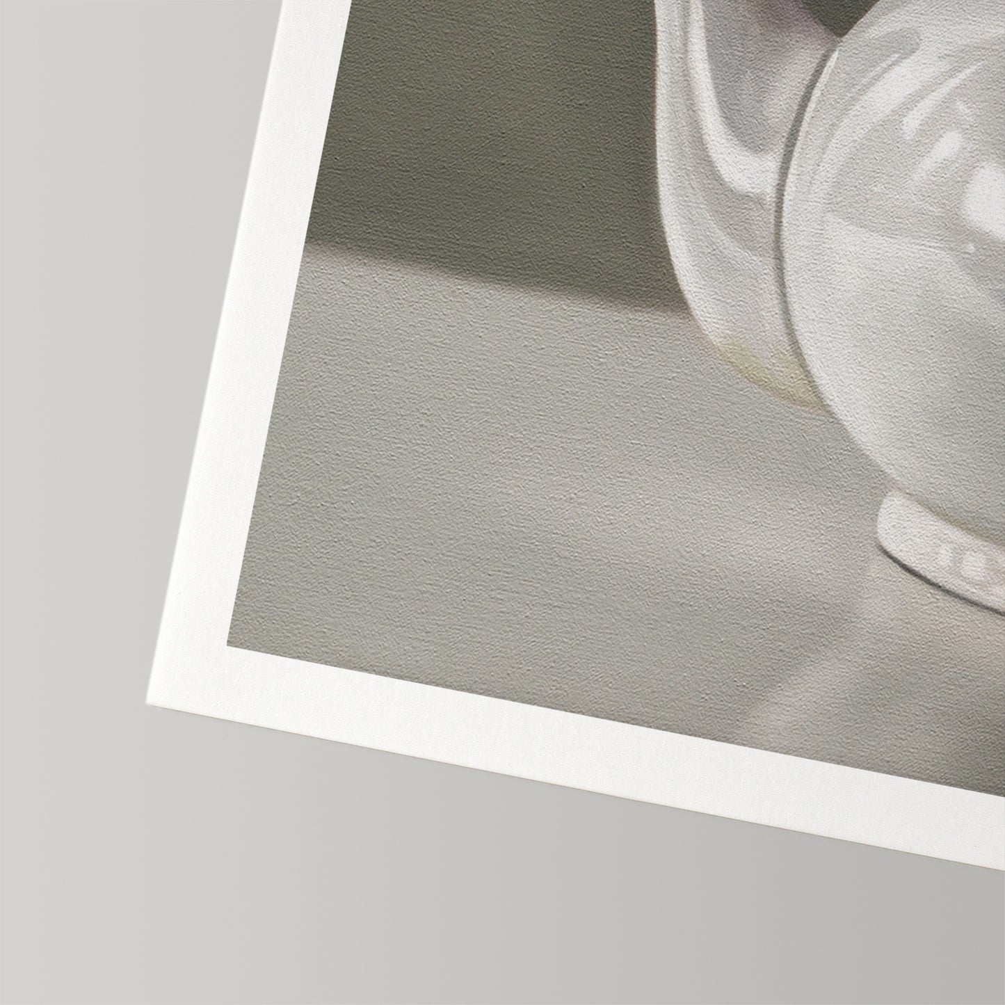 Close-up of a white teapot fine art print on textured cotton rag paper with a white border.