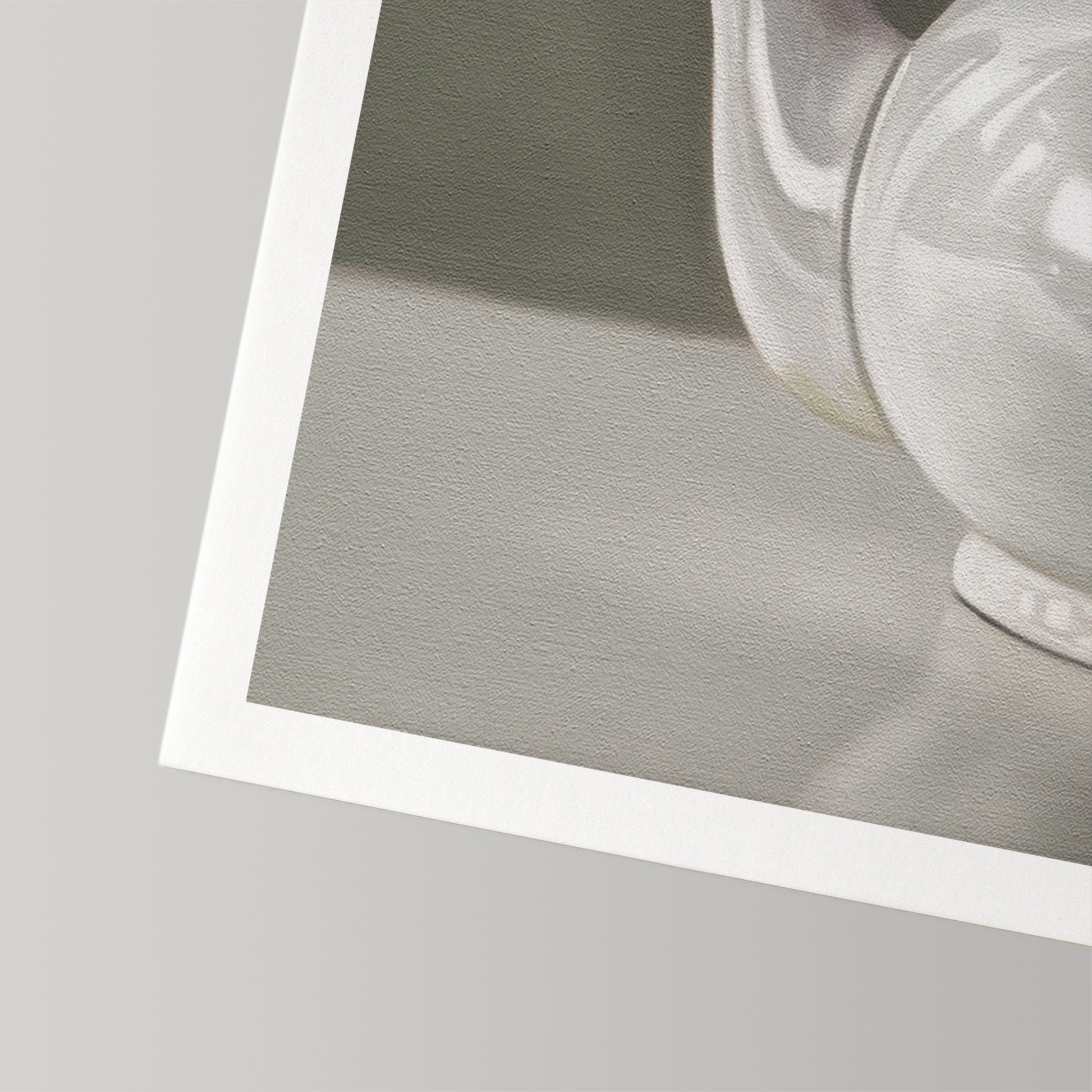 Close-up of a white teapot fine art print on textured cotton rag paper with a white border.