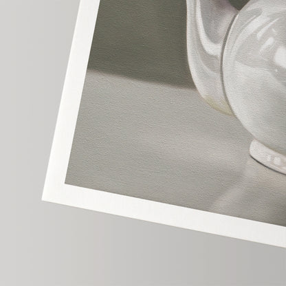Close-up of a white teapot fine art print on textured cotton rag paper with a white border.